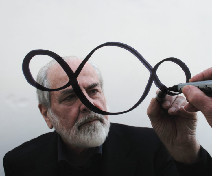 Michelangelo Pistoletto drawing on a mirror
