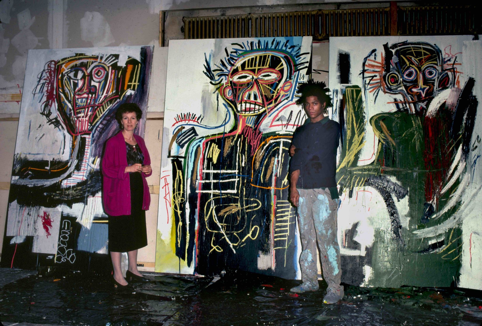 photograph of Annina Nosei and Jean-Michel Basquiat in his studio