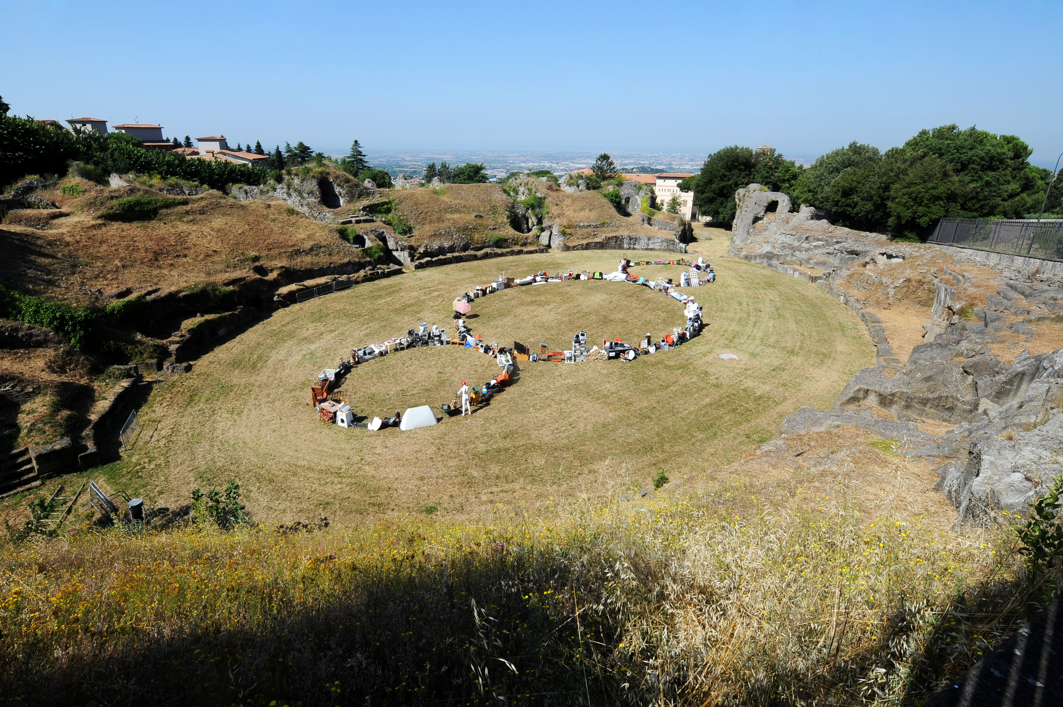 Photograph of different objects laid out in three circles, Michelangelo Pistoletto's third paradise symbol in Albano Laziale