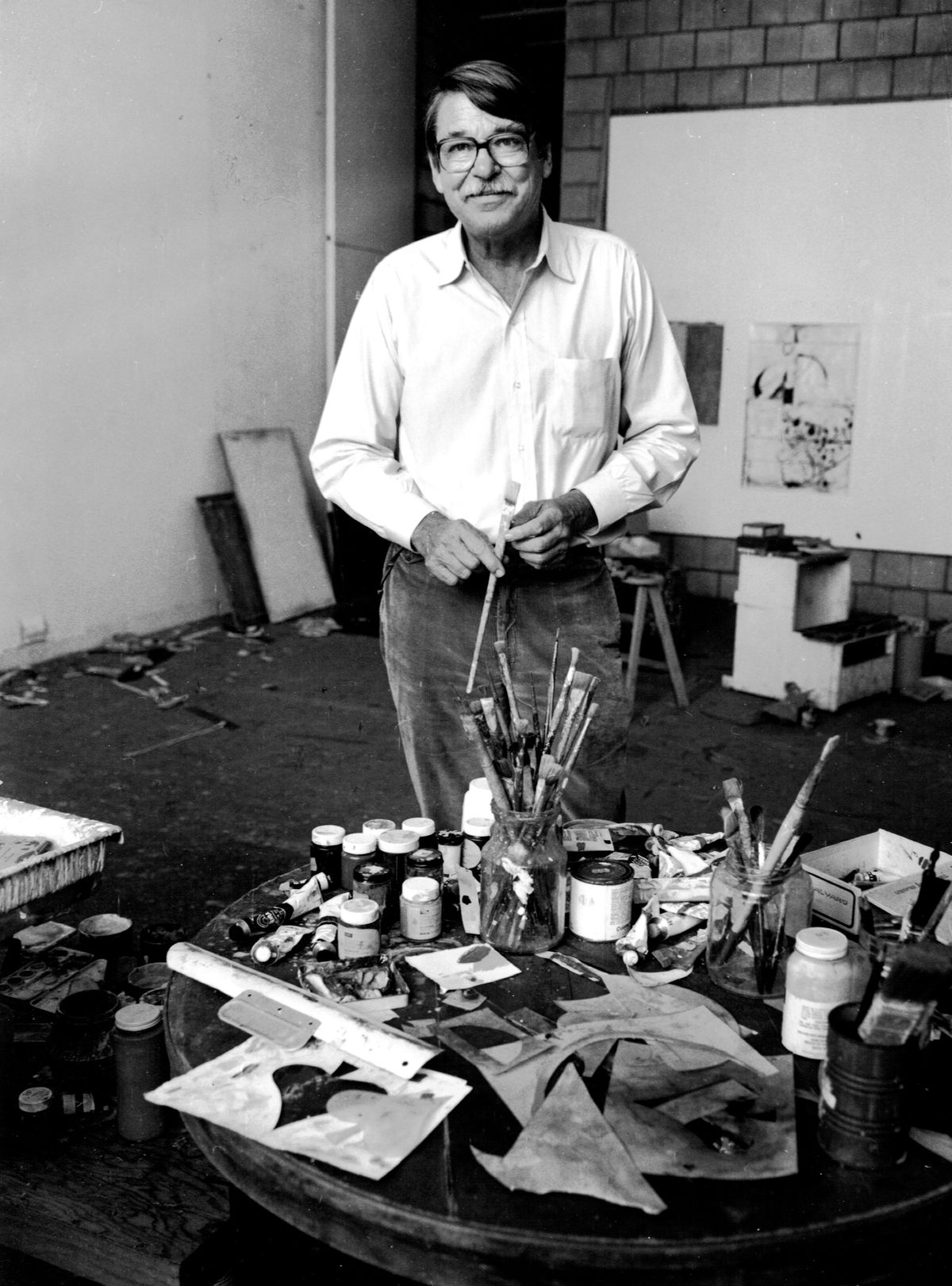 Black and white portrait of Richard Diebenkorn in his studio
