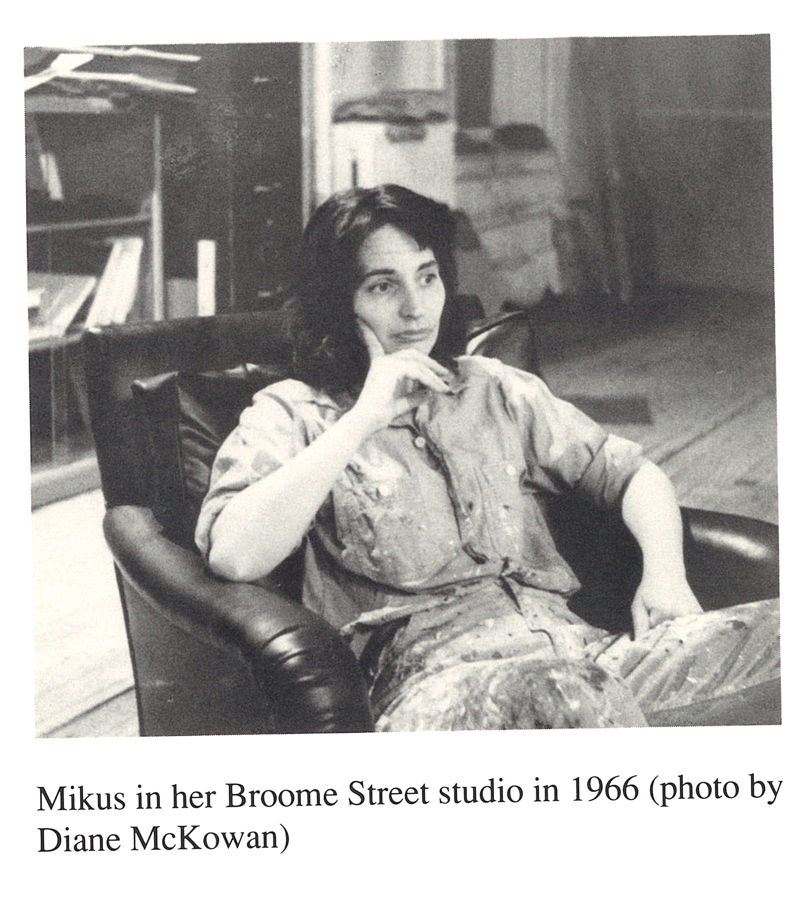 Archival image of Eleanor Mikus sitting in a leather armchair in her Broome Street studio