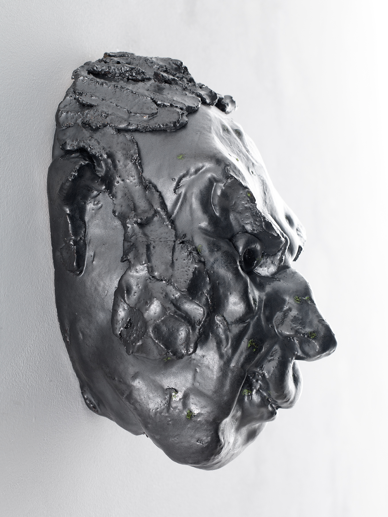 Side view of Thomas Schutte's ceramic sculpture Basler Mask (No. 11)