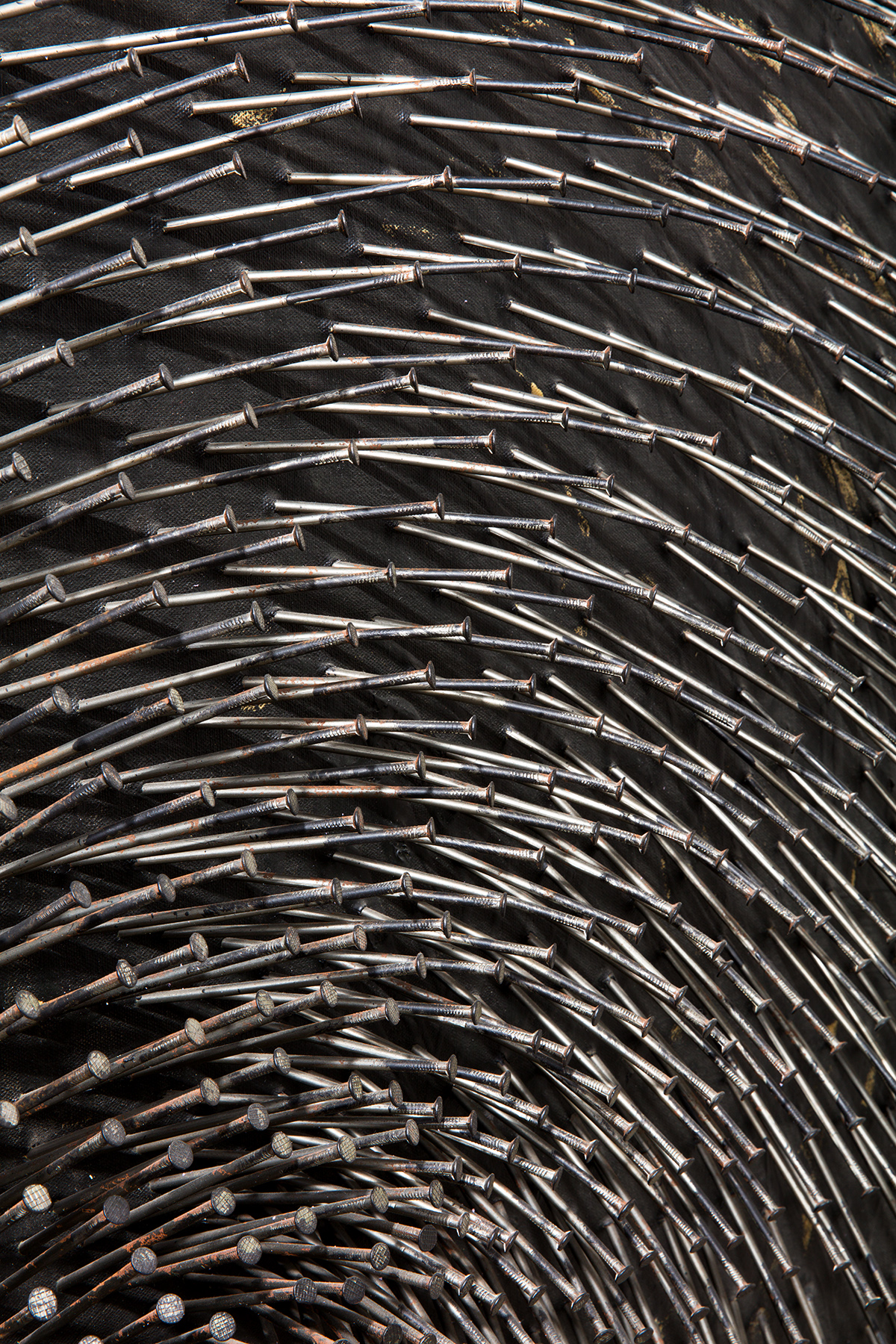 Detail view of Gunther Uecker's nail painting Schwarze Spirale
